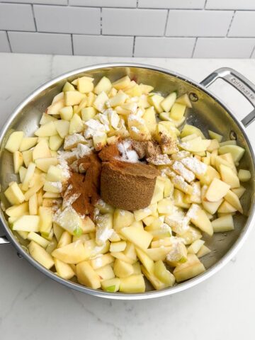 apple pie filling ingredients in skillet.