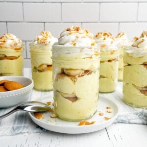 banana pudding cup in a mason jar on a white plate