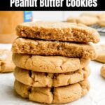 Stack of browned butter peanut butter cookies on white countertop.