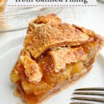 Piece of canned apple pie on a white plate with an apple pie in the background.