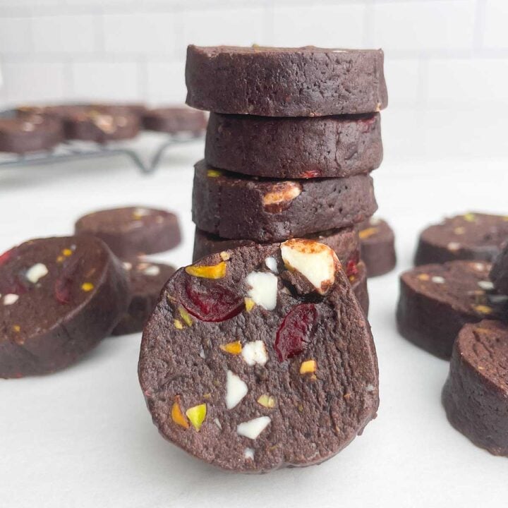 stack of chocolate cherry cookies on white countertop