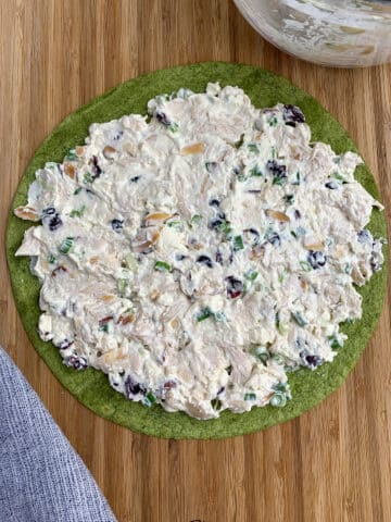 Chicken Cranberry Salad Pinwheel cream cheese mixture on a spinach tortilla. 