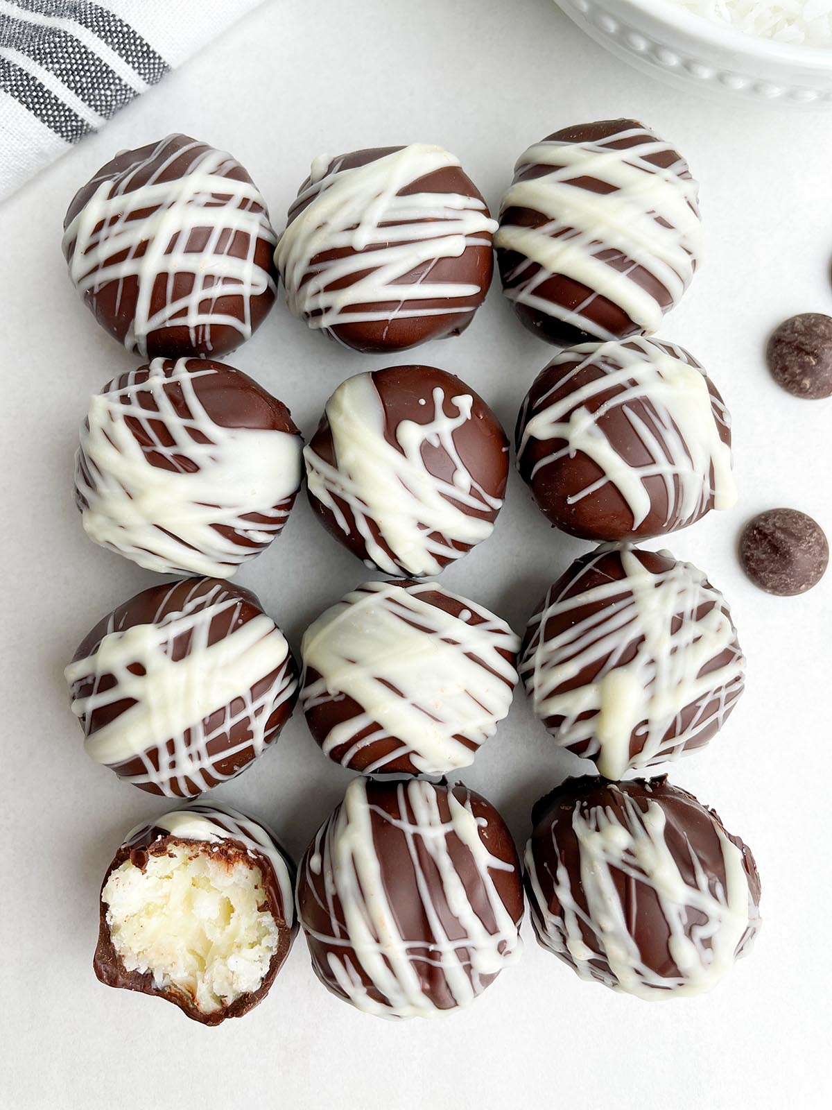 coconut balls on a white countertop.