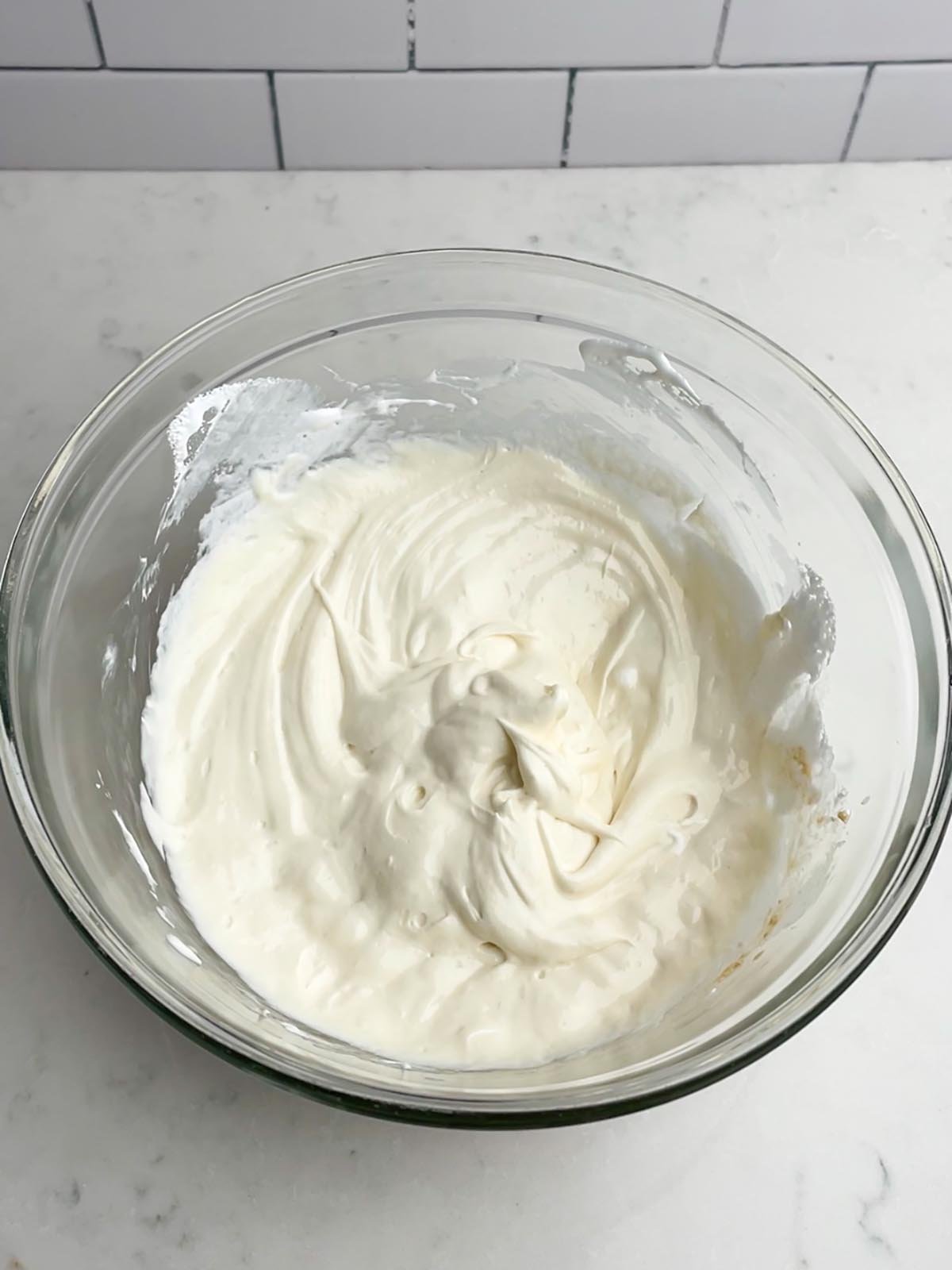 cream cheese chocolate chip dip mixture in a clear bowl