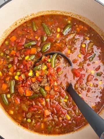 ground beef vegetable soup in a Dutch oven.