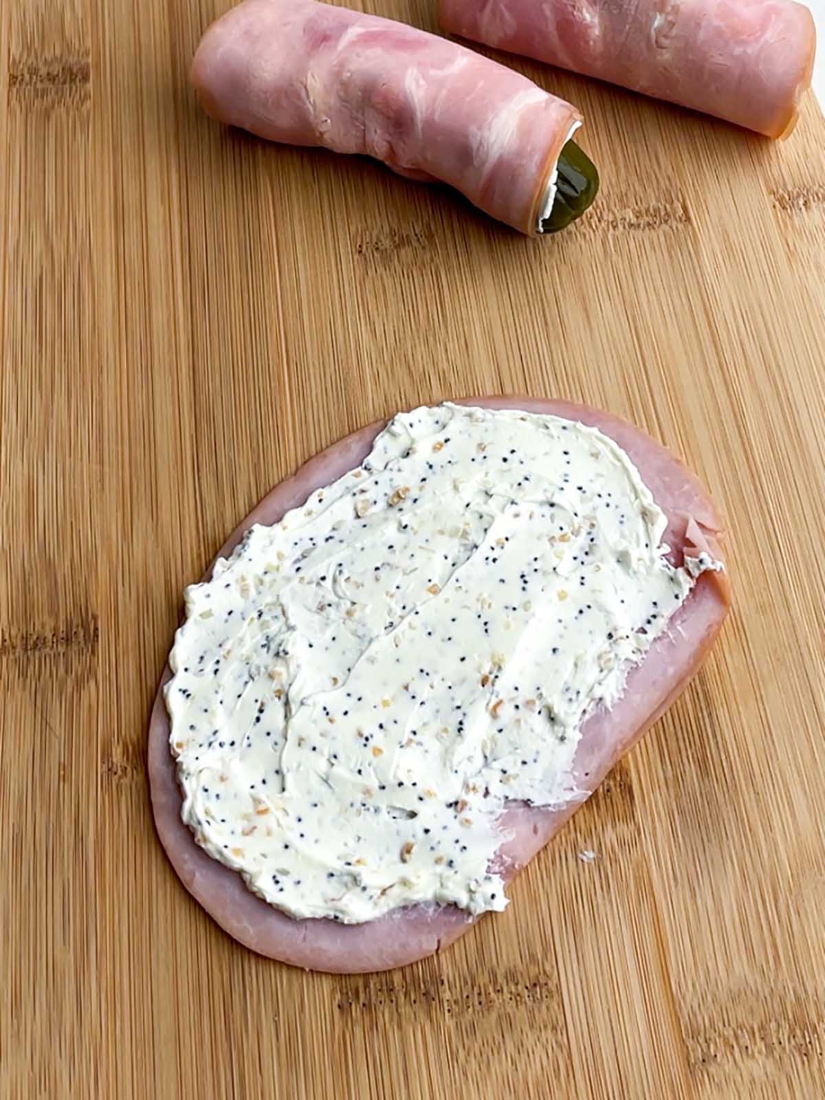 cream cheese spread on a slice of ham