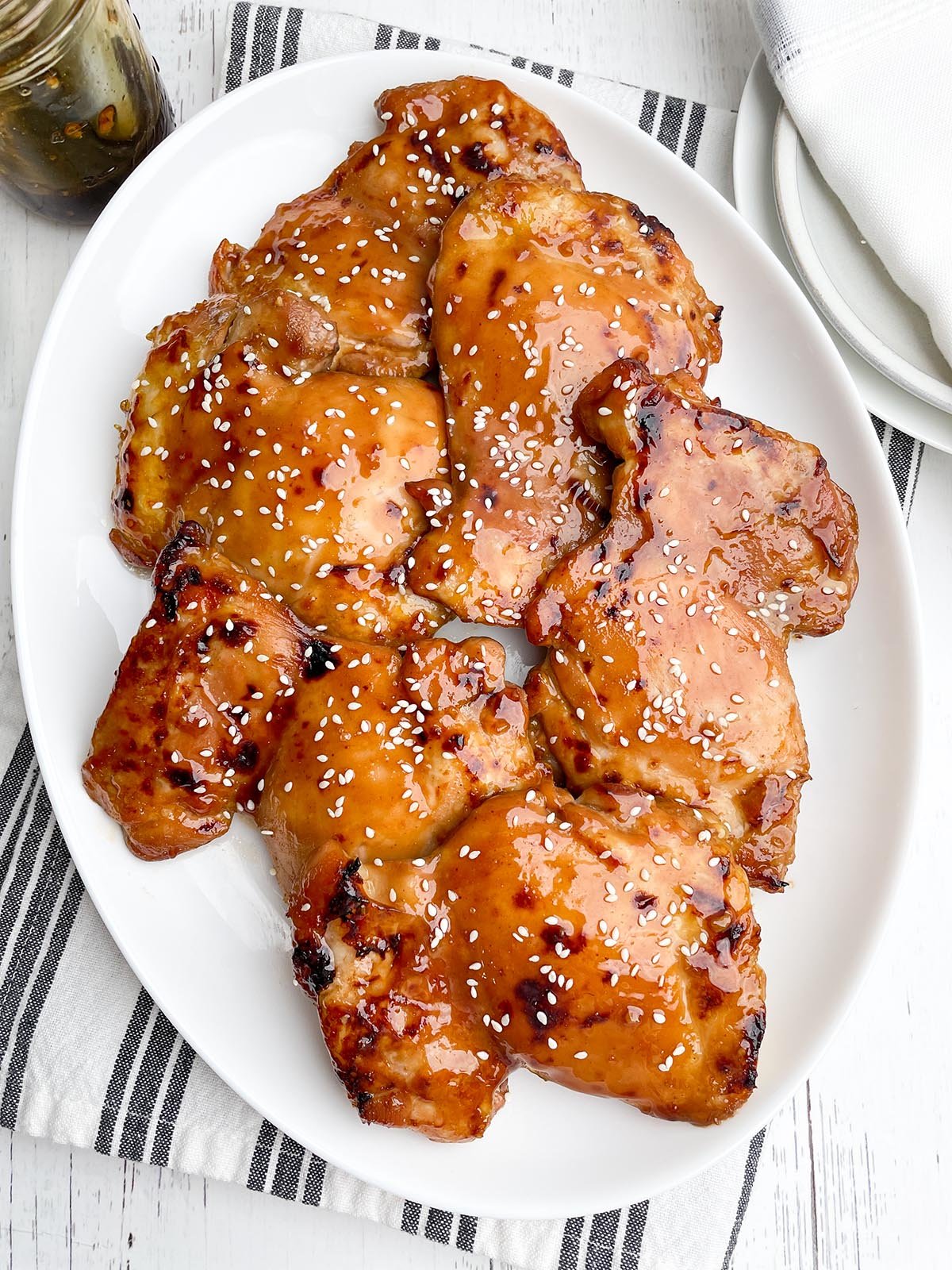 teriyaki boneless chicken thighs on a white platter