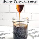 spoon drizzling honey teriyaki sauce into a mason jar of sauce