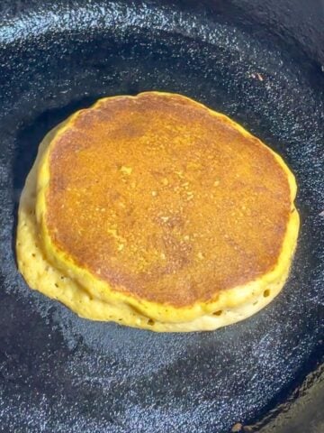 pumpkin pancake in a cast iron skillet.
