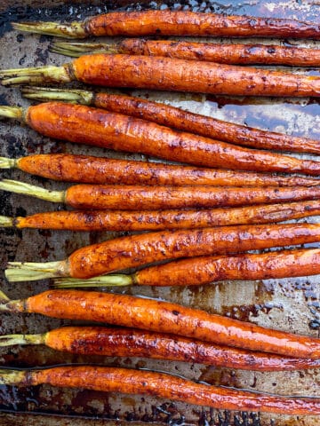 roasted Balsamic Glazed Carrots on a baking sheet.
