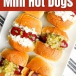 mini hot dog appetizers on a white platter