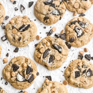 Peanut butter Oreo cookies on white parchment paper.