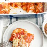 pizza casserole on a white plate in front of a casserole dish.