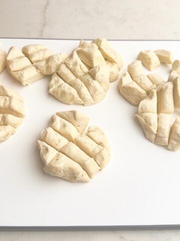 cut up biscuits on a cutting board.