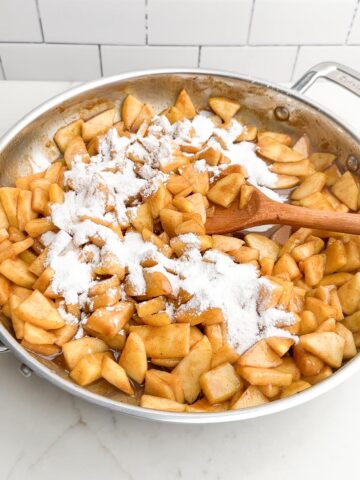 cornstarch mixture over cooked apples in skillet.