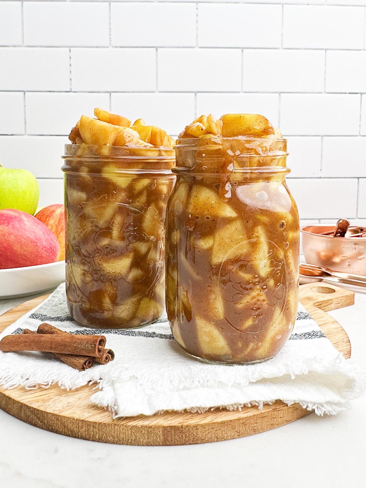 mason jars filled with pre cooked apple pie filling.