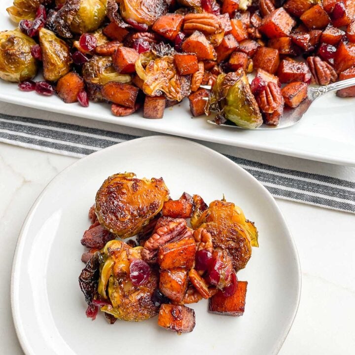 roasted brussels sprouts and sweet potatoes on white plate