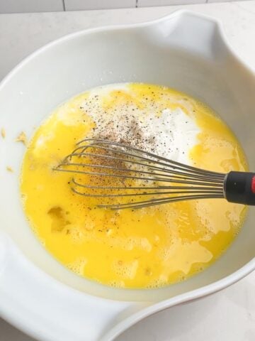eggs mixture in white bowl.