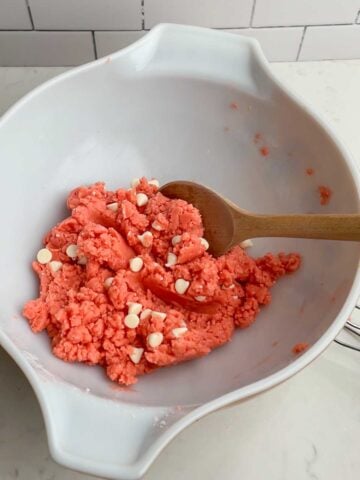 Strawberry Brownie batter with white chocolate chips in a white bowl.